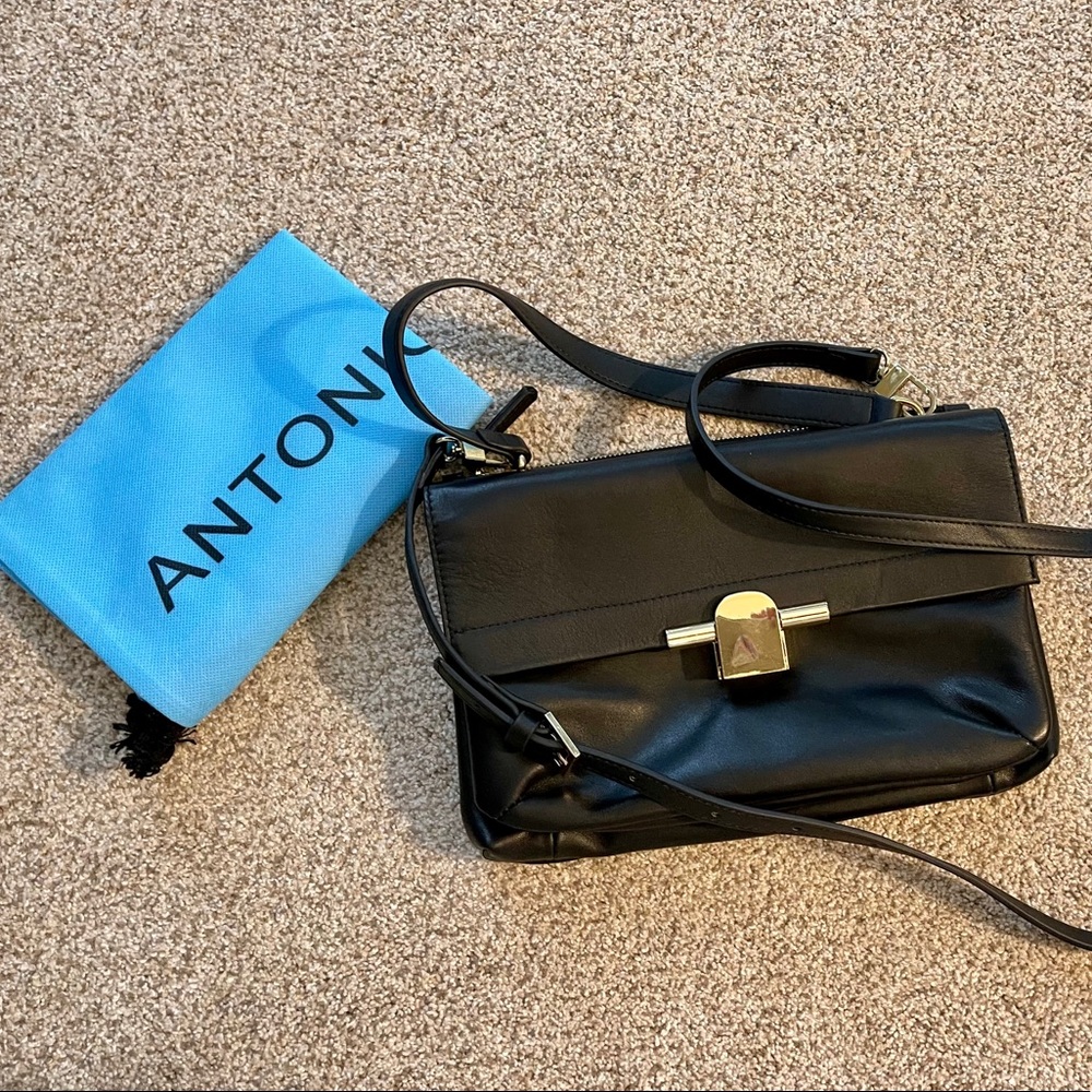 NWT. Antonio Melani black leather purse.